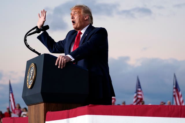 President Donald Trump speaks during a campaign rally at Orlando Sanford International Airport on Monday, his return to the trail after a coronavirus infection. (AP Photo/Evan Vucci)