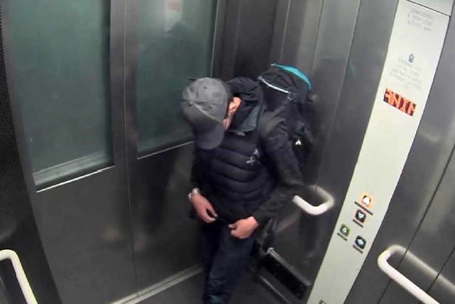 Salman Abedi adjusting wiring underneath his clothing as he carries his suicide bomb in a lift at Manchester Arena shortly before the attack on 22 May 2017
