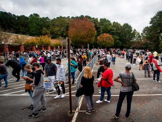 Hundreds of people wait in line for early voting on Monday 12 October 2020, in Marietta, Georgia.