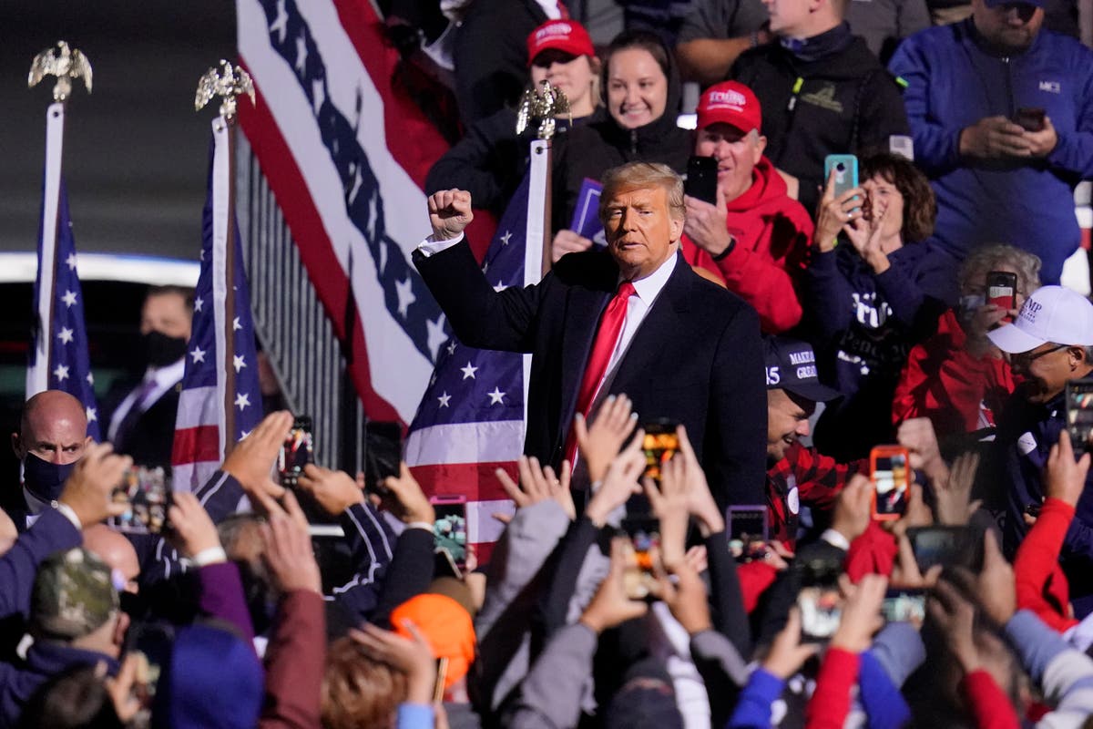 Trump falsely tells rally he and other coronavirus survivors are now immune: 'Look at that handsome guy, I'd kiss him'