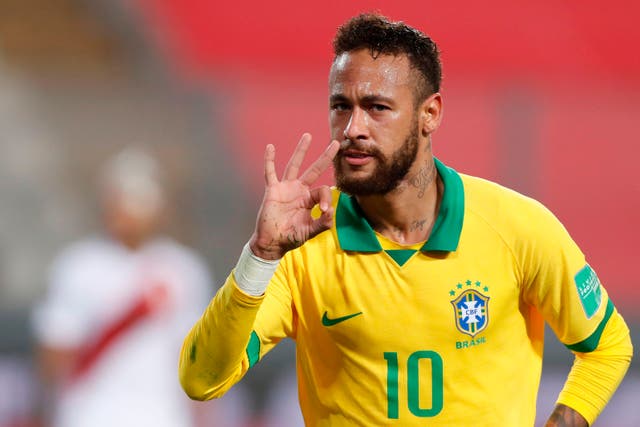 Neymar celebrates after scoring his hat-trick goal against Peru