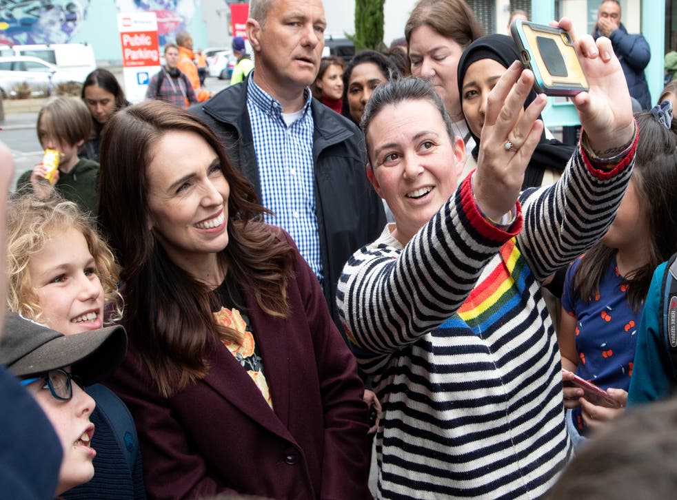 New Zealand prime minister and Labour Party leader Jacinda Ardern has a selfie taken with supporters during a walkabout in central Christchurch