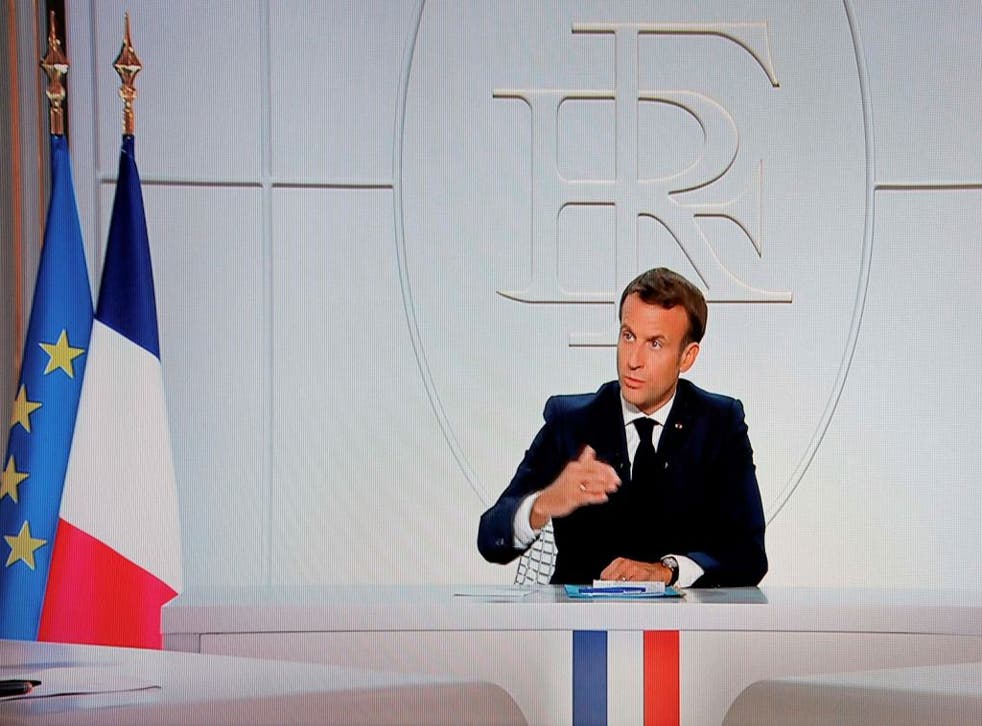 French President Emmanuel Macron addresses the nation during a televised interview from the Elysee Palace concerning the coronavirus situation in France, in Paris on 14 October, 2020
