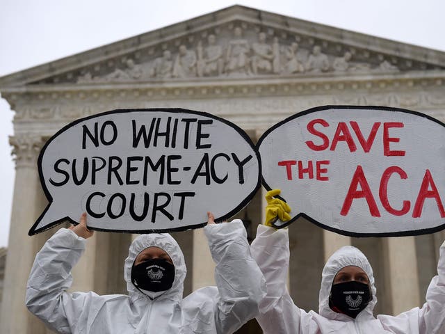 Members of Planned Parenthood protest in front of the Supreme Court on the first day of the nomination hearing for President Donald Trump's Supreme Court nominee, Amy Coney Barrett