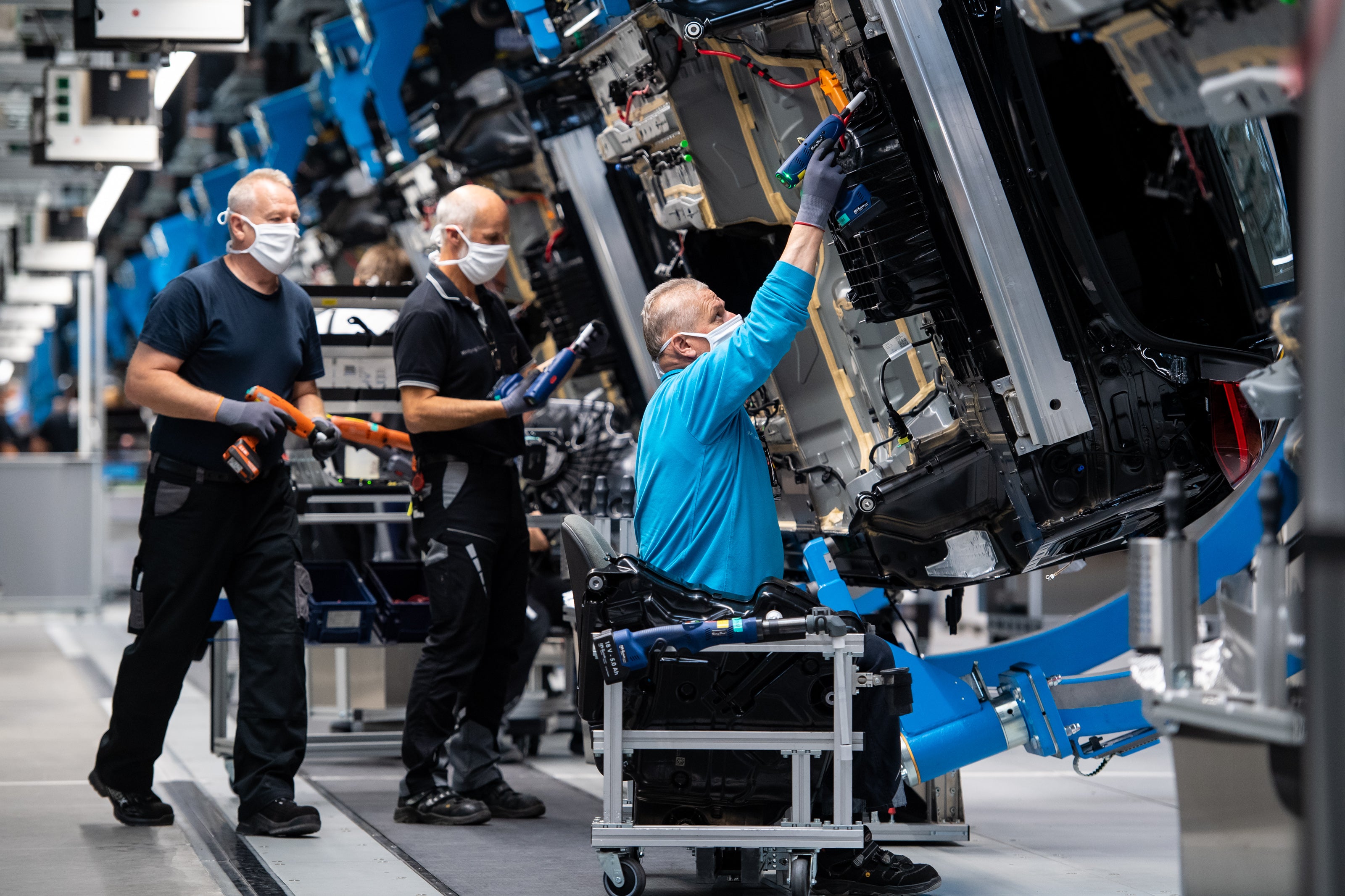Workers at a Mercedes car manufacturing plant in Sindelfingen, Germany