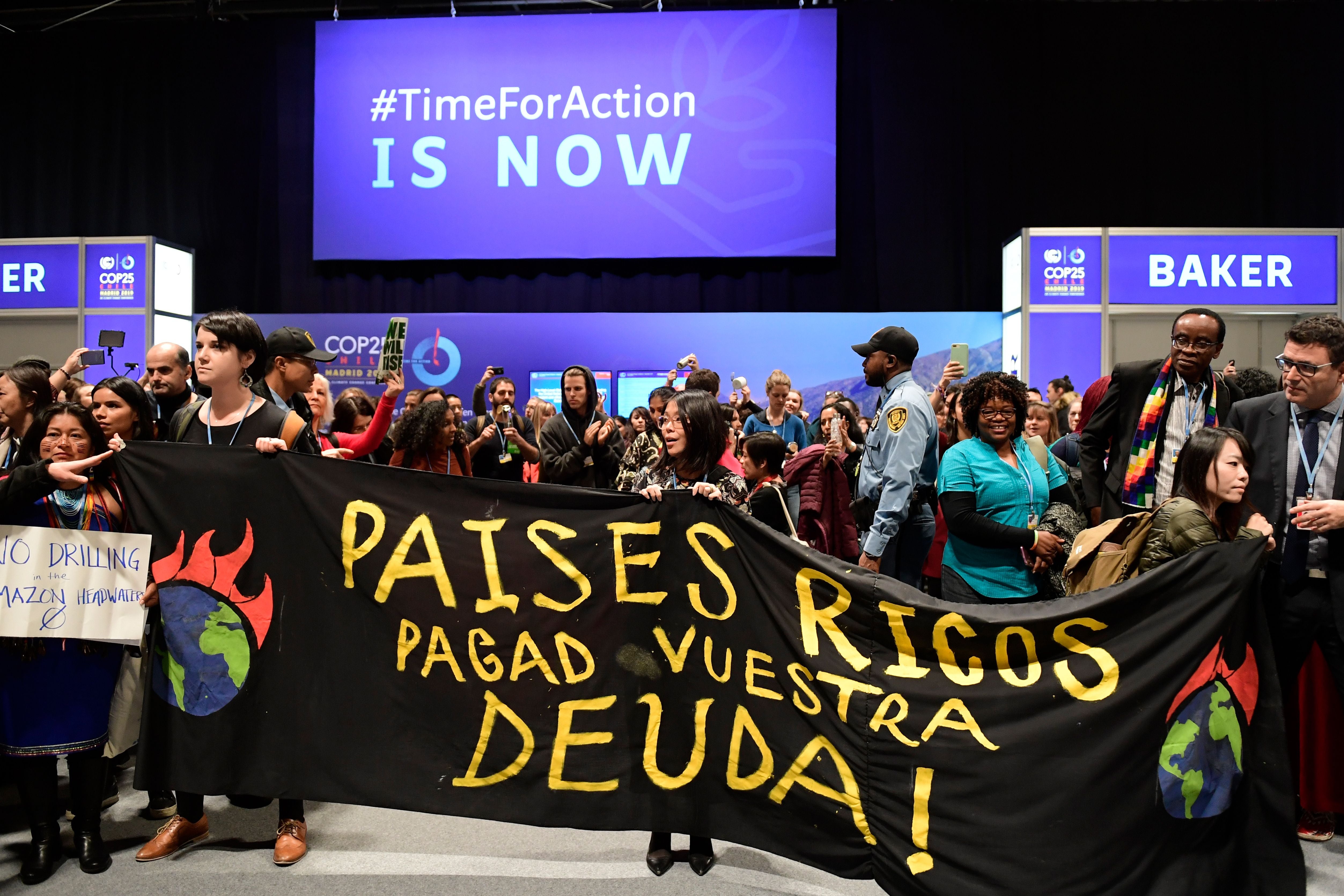 Campaigners at Cop25 in Madrid urge rich countries to pay debts and stop deforestation in the Amazon