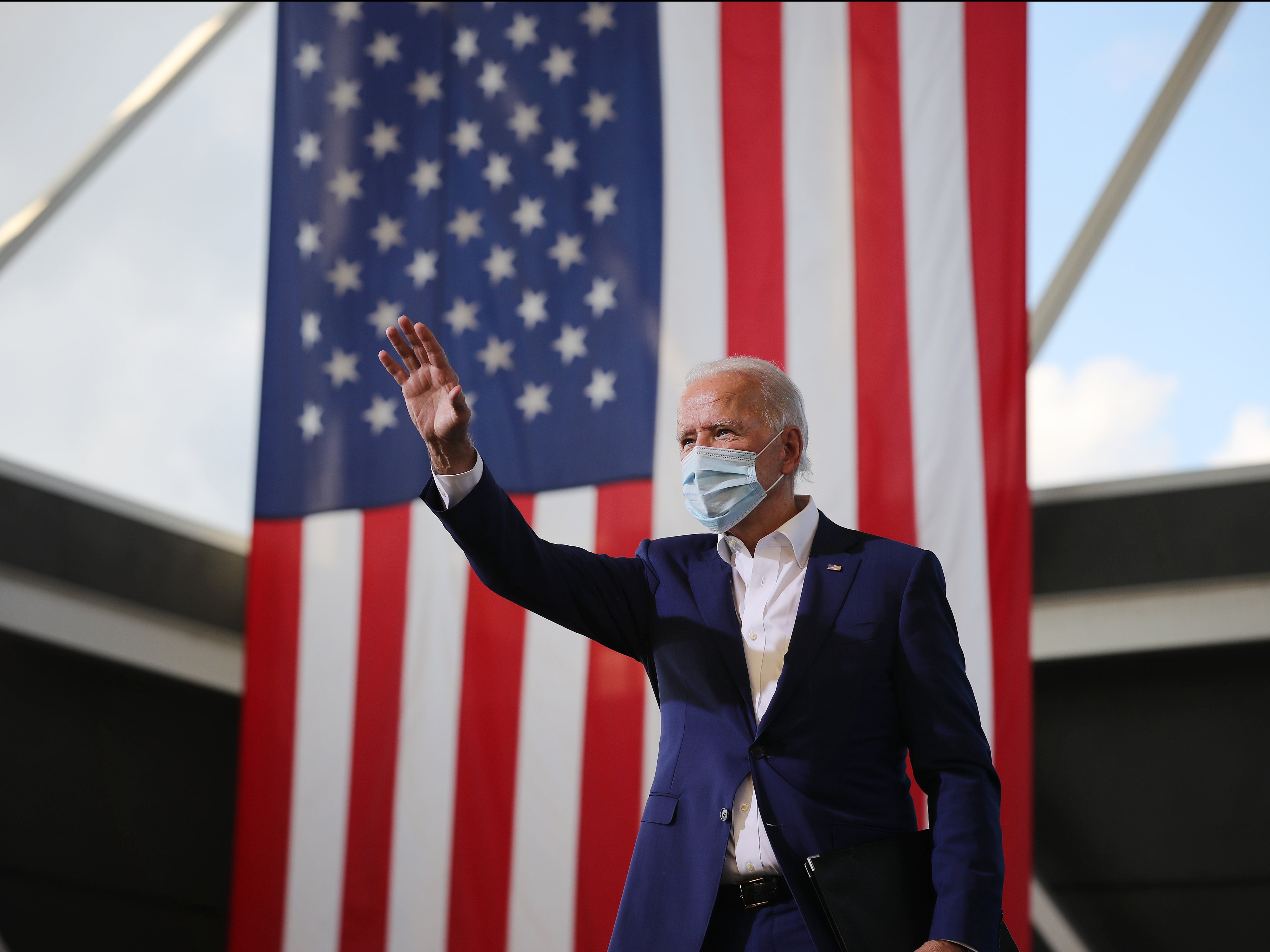 Biden waves to supporters during a drive-in voter mobilisation event at Miramar Regional Park, in Florida, on Tuesday