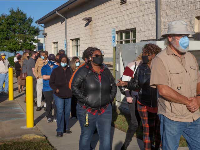 People wait in line to cast their ballot on the first day of early voting at the Hamilton County Election Commission in Chattanooga, Tennessee on Wednesday