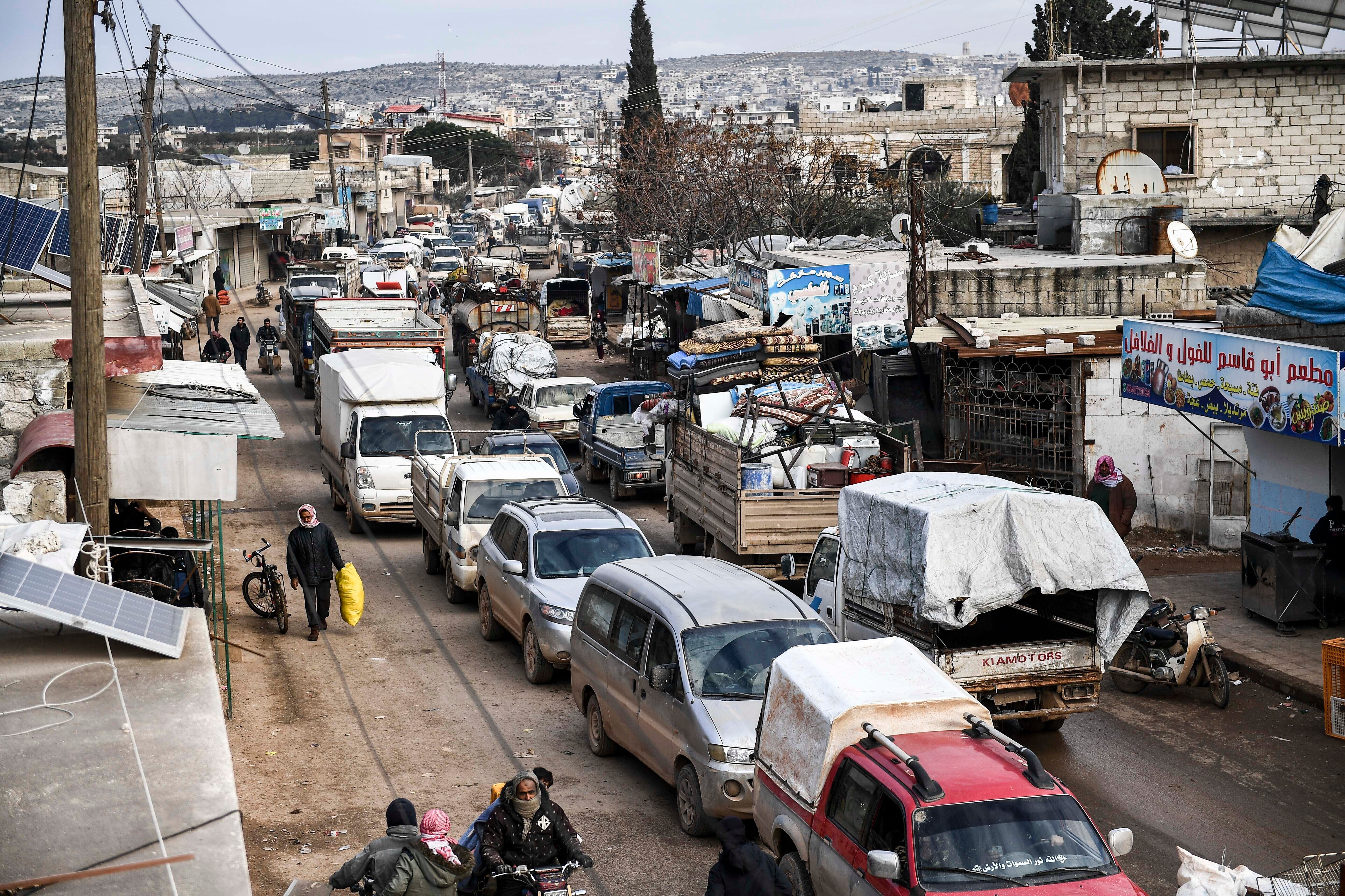 Civilians flee from Idlib in February during a year-long military campaign by Syrian and Russian forces