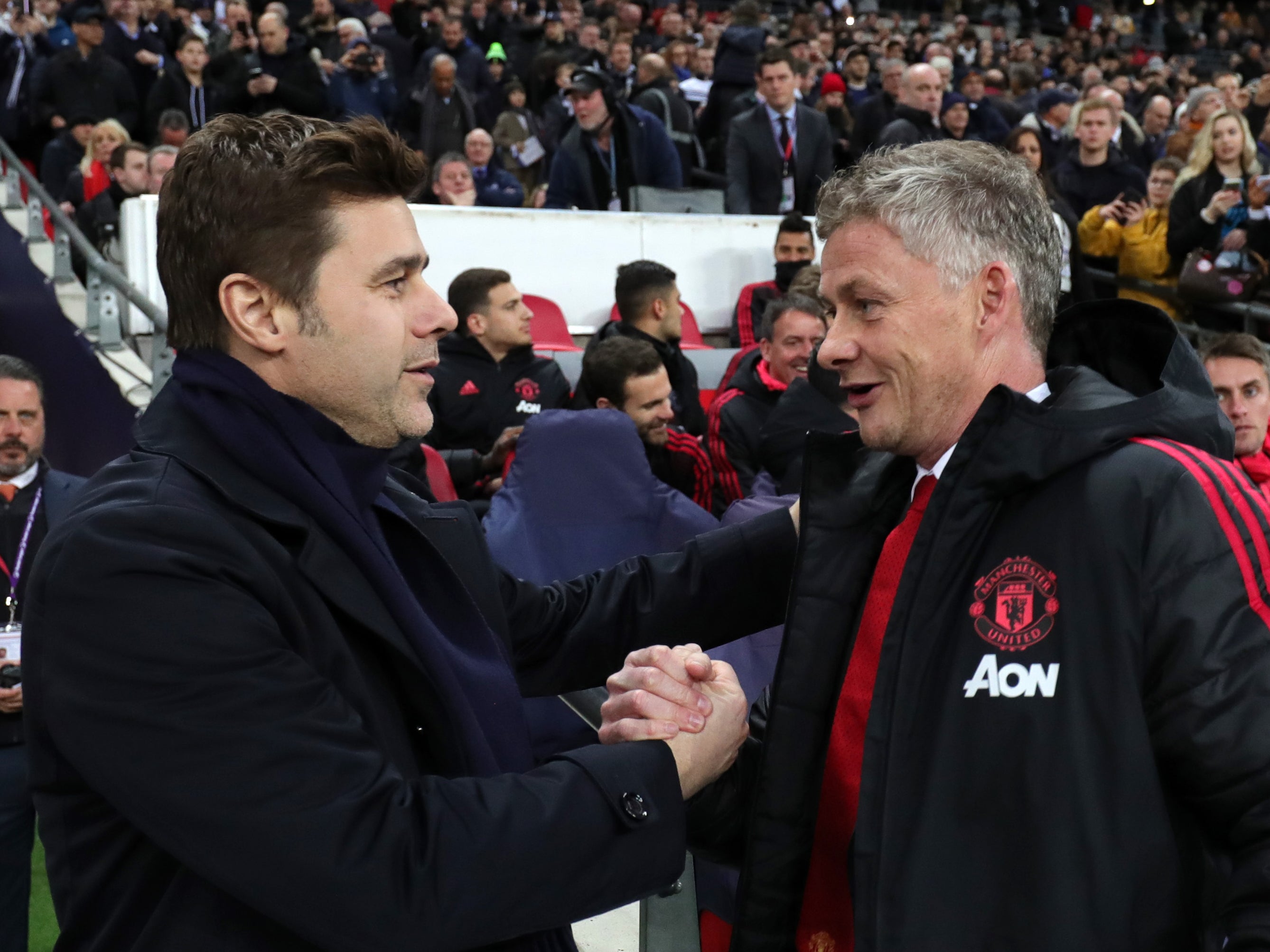 Former Tottenham manager Mauricio Pochettino (left) with Ole Gunnar Solskjaer