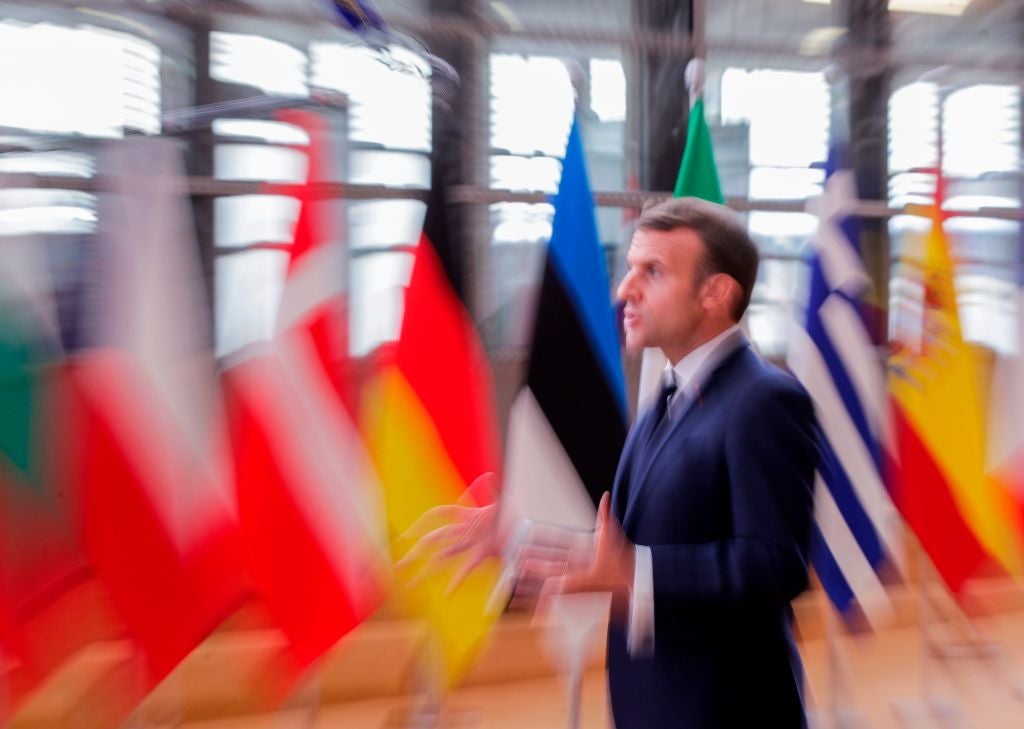 Emmanuel Macron speaks to the press as he arrives prior to an EU summit in Brussels this week