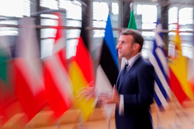 Emmanuel Macron speaks to the press as he arrives prior to an EU summit in Brussels this week