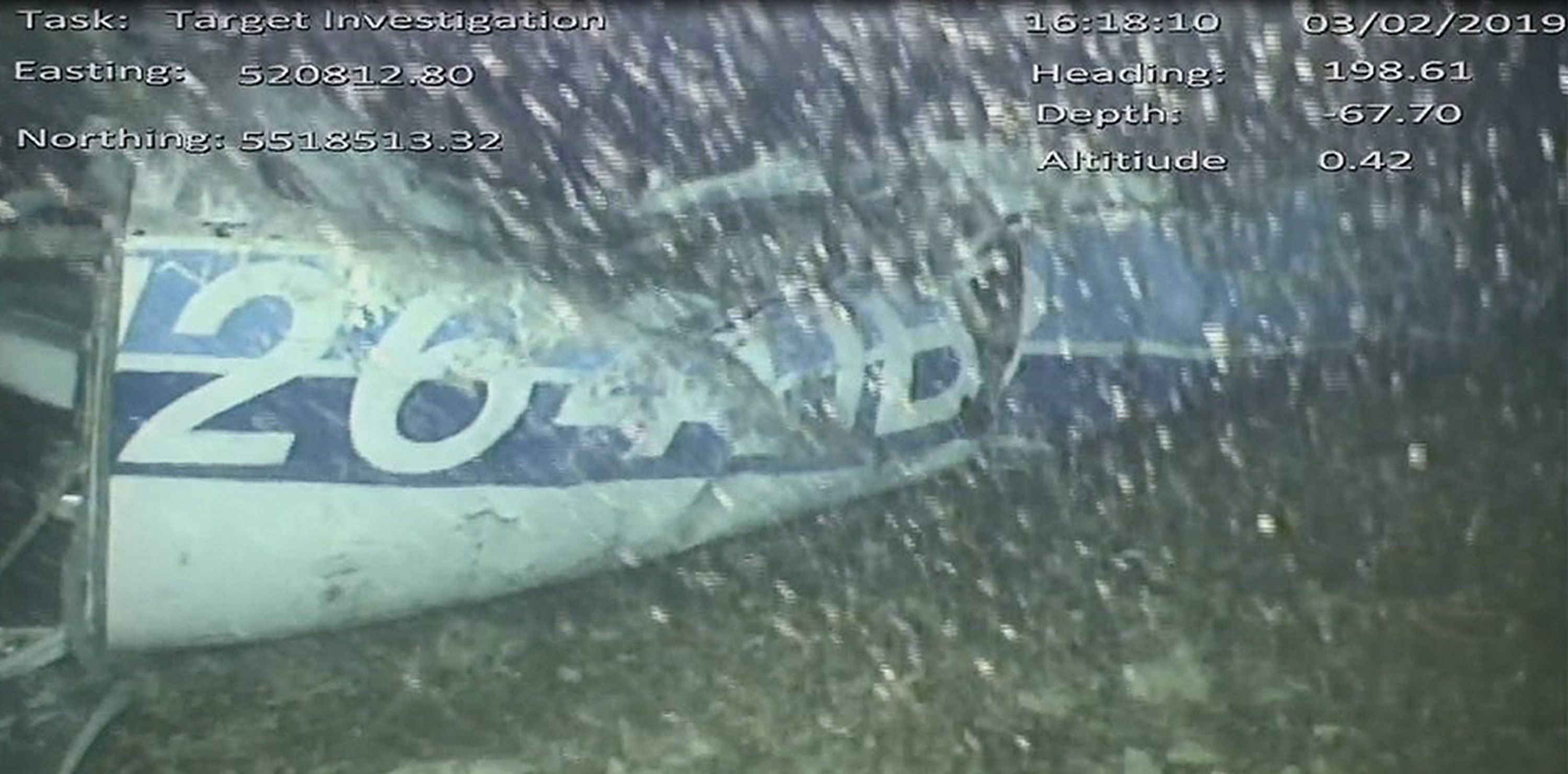A handout video footage still image released by the UK Air Accidents Investigation Branch (AAIB) shows the rear left side of the fuselage, including part of the aircraft registration