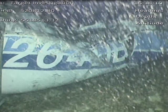 A handout video footage still image released by the UK Air Accidents Investigation Branch (AAIB) shows the rear left side of the fuselage, including part of the aircraft registration
