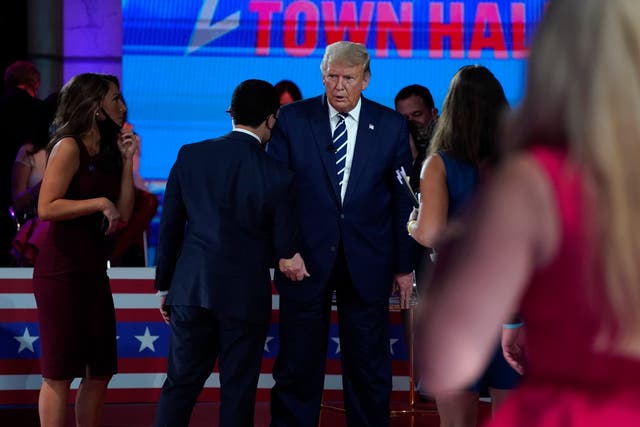 President Donald Trump attended an NBC News Town Hall, at Perez Art Museum Miami, Thursday, Oct. 15, 2020, in Miami. (AP Photo/Evan Vucci)