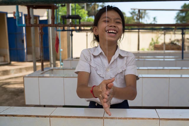 <p>A student at the WASH facility at Kampong Thmar Primary School</p>