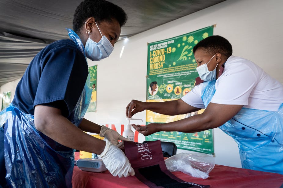 Nurses working in a South African Covid-19 clinic, based on a train, which travels to reach different communities