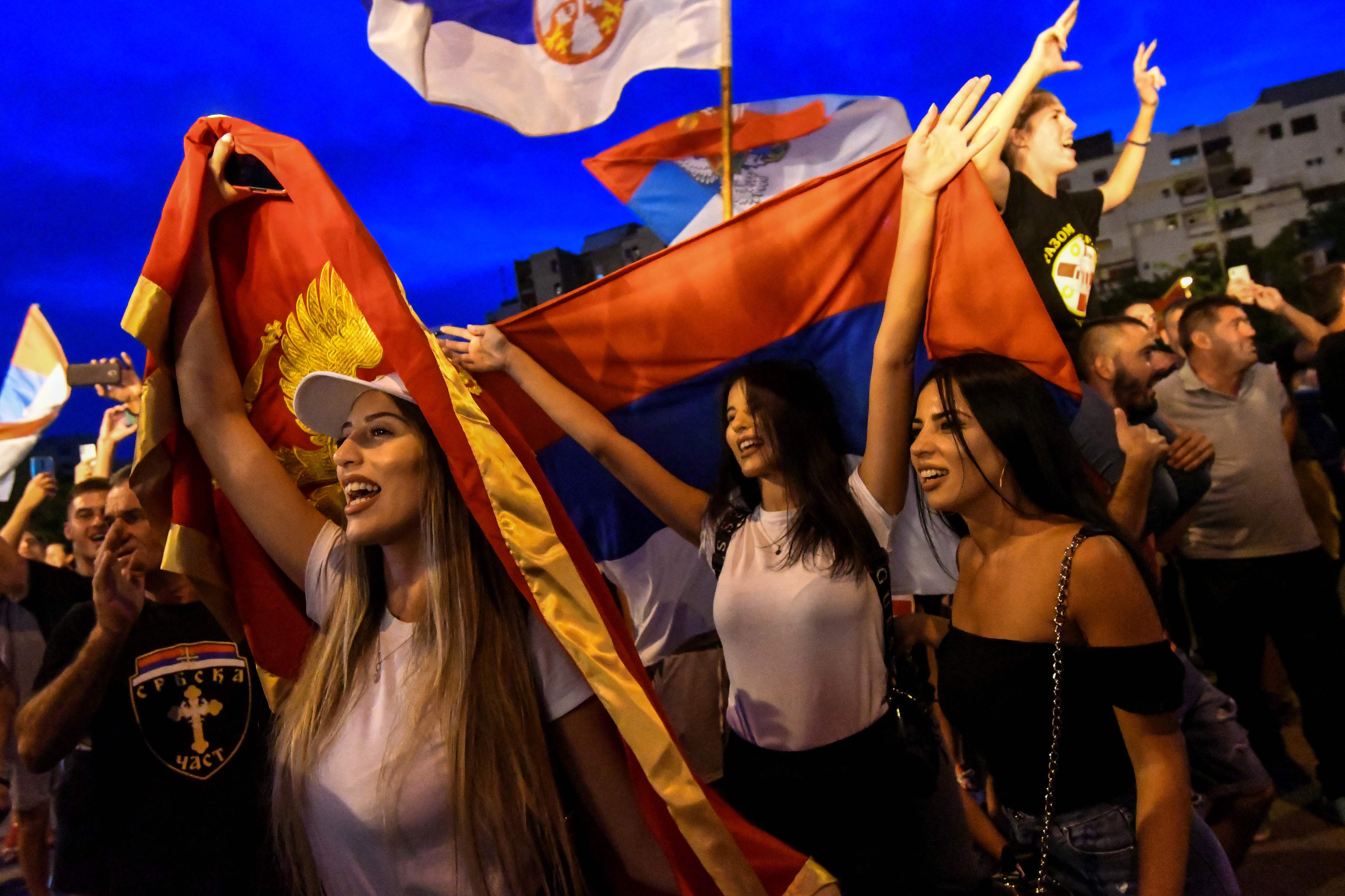 Opposition supporters celebrate on the streets after the general elections in Podgorica, Montenegro, on August 31, 2020. (Photo by SAVO PRELEVIC/AFP via Getty Images)