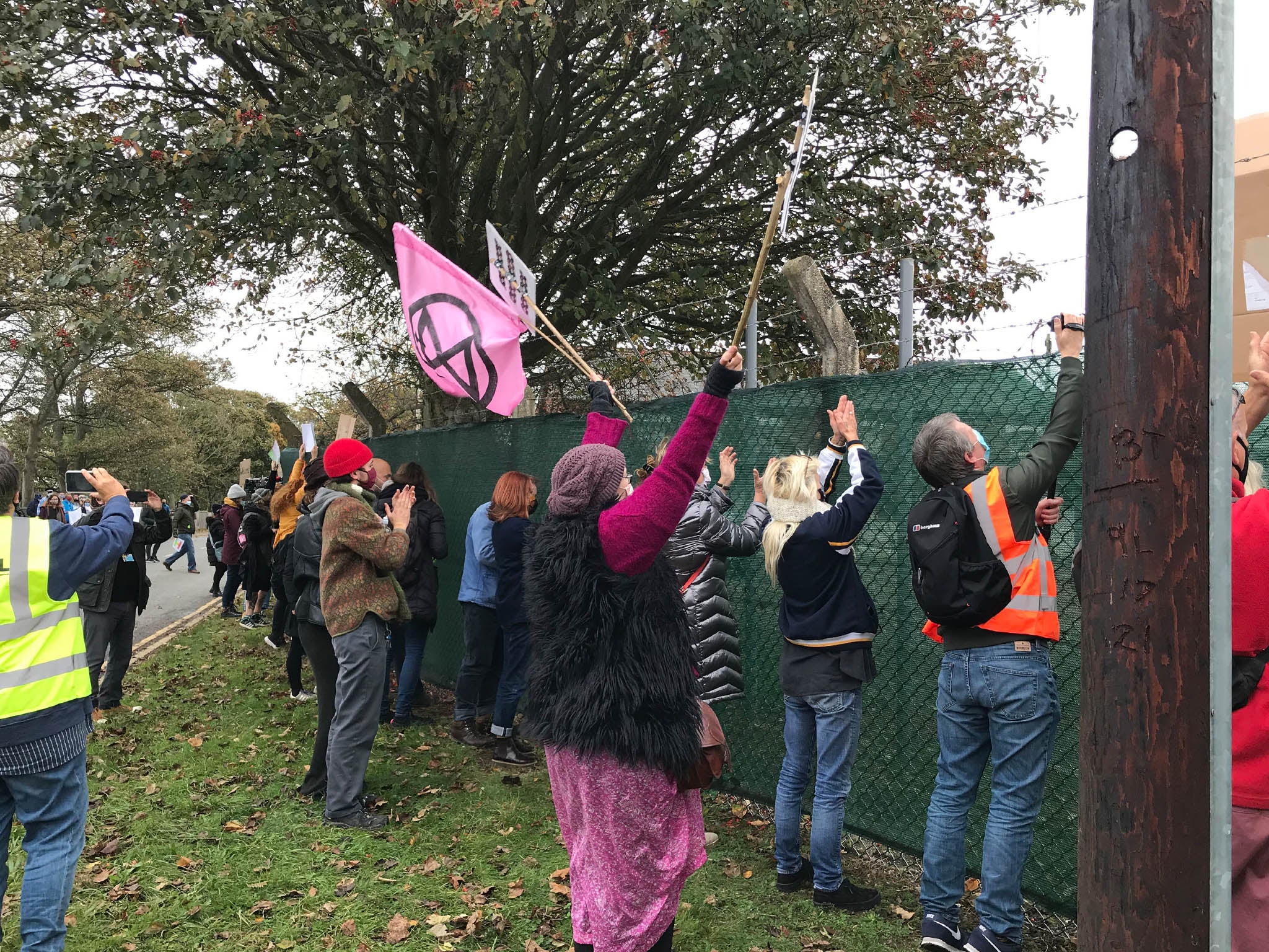 Pro-migrant demonstrators outside barracks in Kent to show support for welcoming migrants to the area