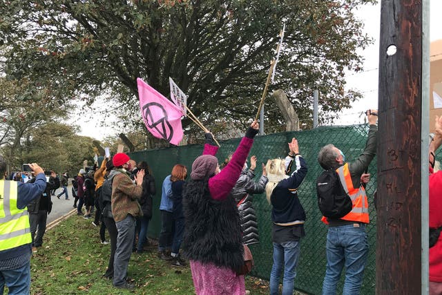 Pro-migrant demonstrators outside barracks in Kent to show support for welcoming migrants to the area 