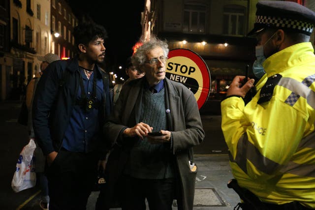 Police chat with Piers Corbyn in Soho on Friday night