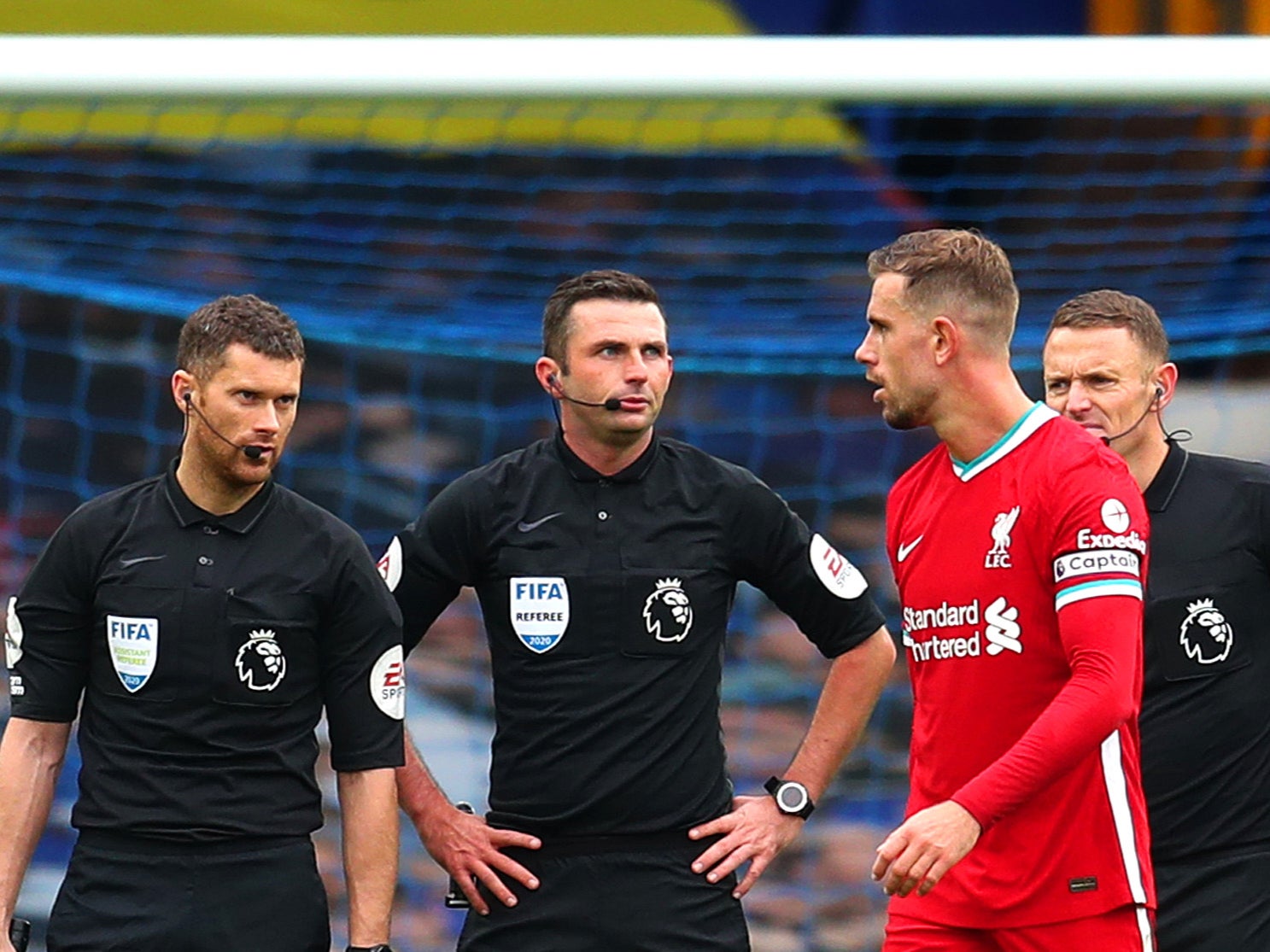 Jordan Henderson speaks with match officials after his goal is disallowed