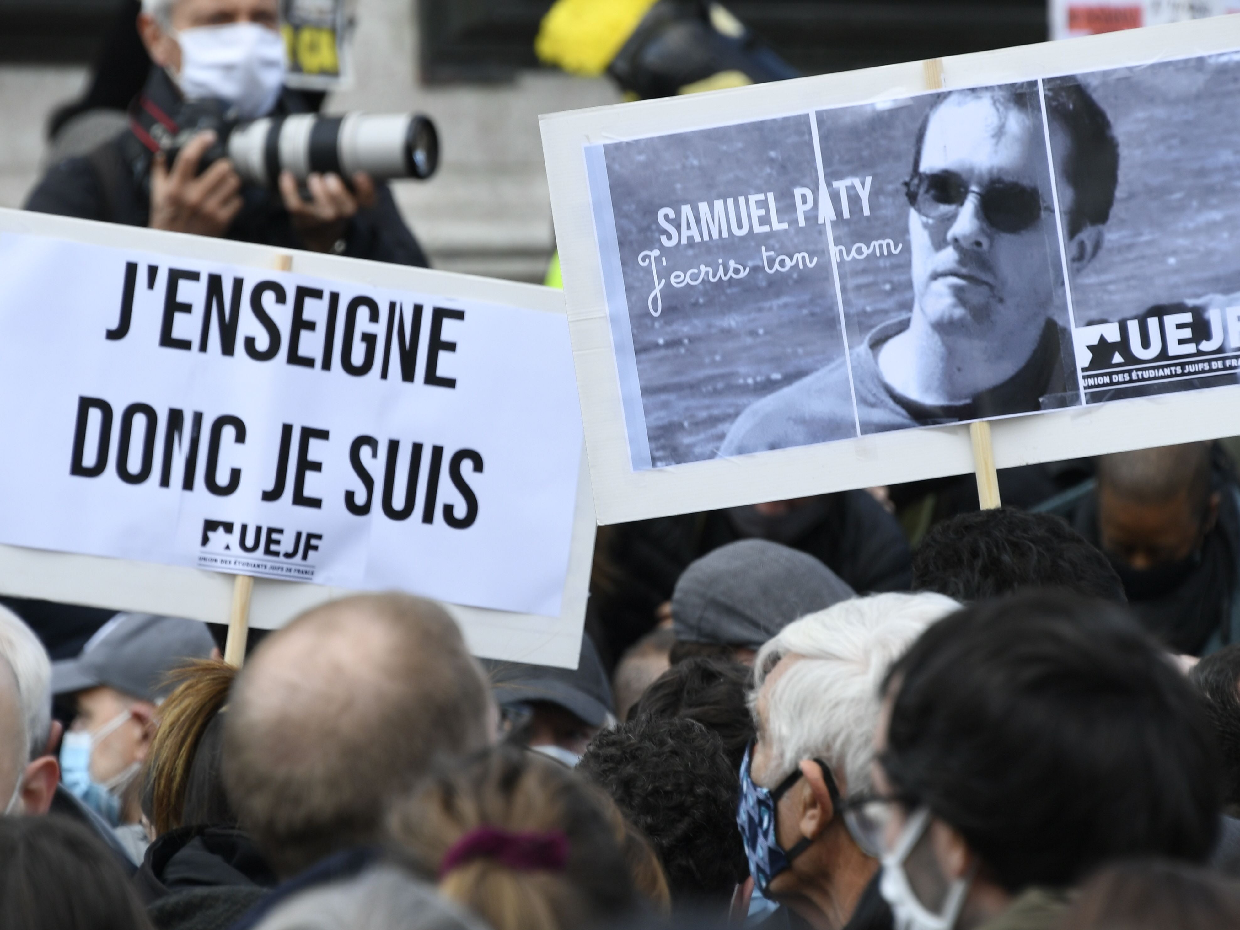 People have taken to the street in France in a show of solidarity and defiance following the beheading of Samuel Paty