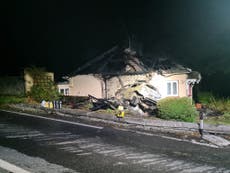 Man arrested on suspicion of arson after crashing car into house