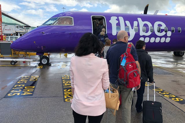Airborne again? Passengers boarding a Flybe aircraft at Manchester airport before the airline collapsed in March 2020