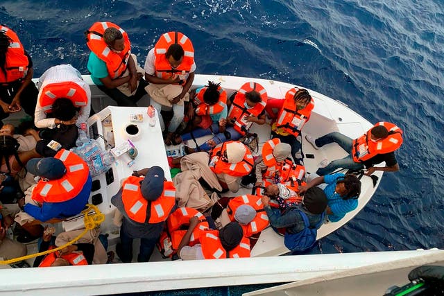 This photo provided by Carnival Cruise Line shows people after being rescued by a Carnival Cruise Line ship off the Florida coast, the cruise line reported on Saturday 17 October 2020