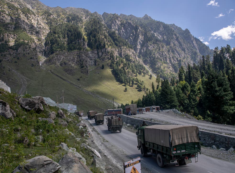 An Indian army convoy moves on the Srinagar- Ladakh highway at Gagangeer, northeast of Srinagar, Indian-controlled Kashmir