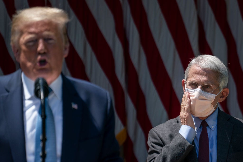 Dr Fauci looks on as president Trump delivers remarks about coronavirus vaccine development in the Rose Garden of the White House on May 15, 2020