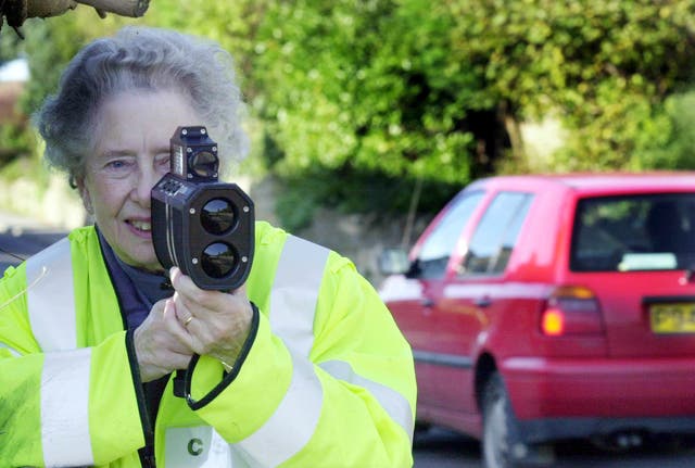 An archive photo shows a volunteer in Ash, Somerset, with a speed gun. 
