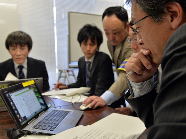 Japanese government officers held a cyber security drill in 2014 as country prepared to host the 2020 Olympics