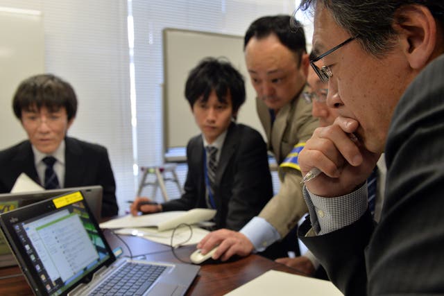 Japanese government officers held a cyber security drill in 2014 as country prepared to host the 2020 Olympics