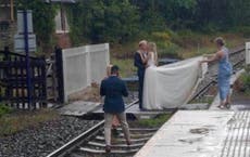 Couple criticised for trespassing on railway line to take wedding pictures