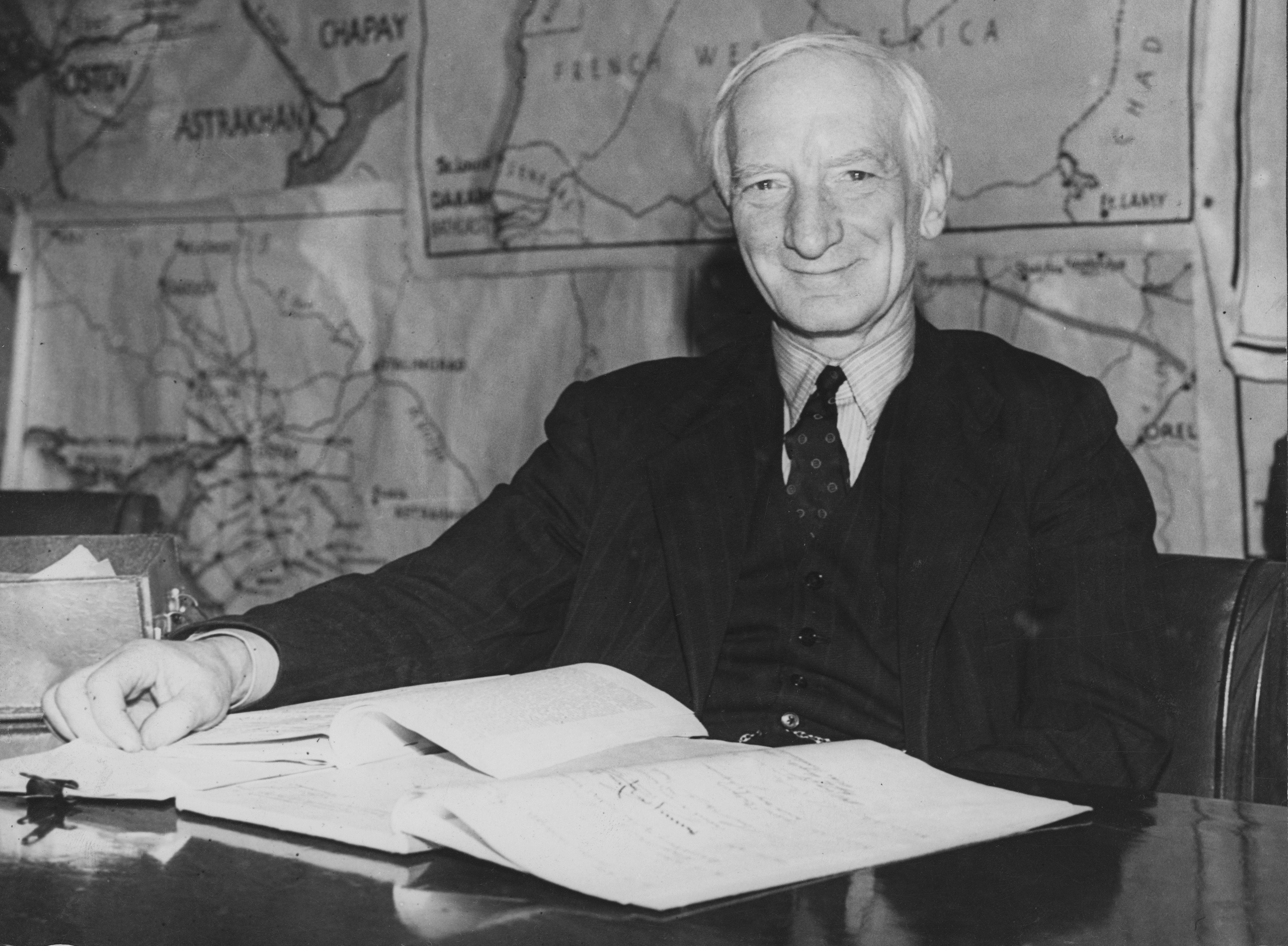 William Beveridge with his report on social security during a press conference at the Ministry of Information, 1942