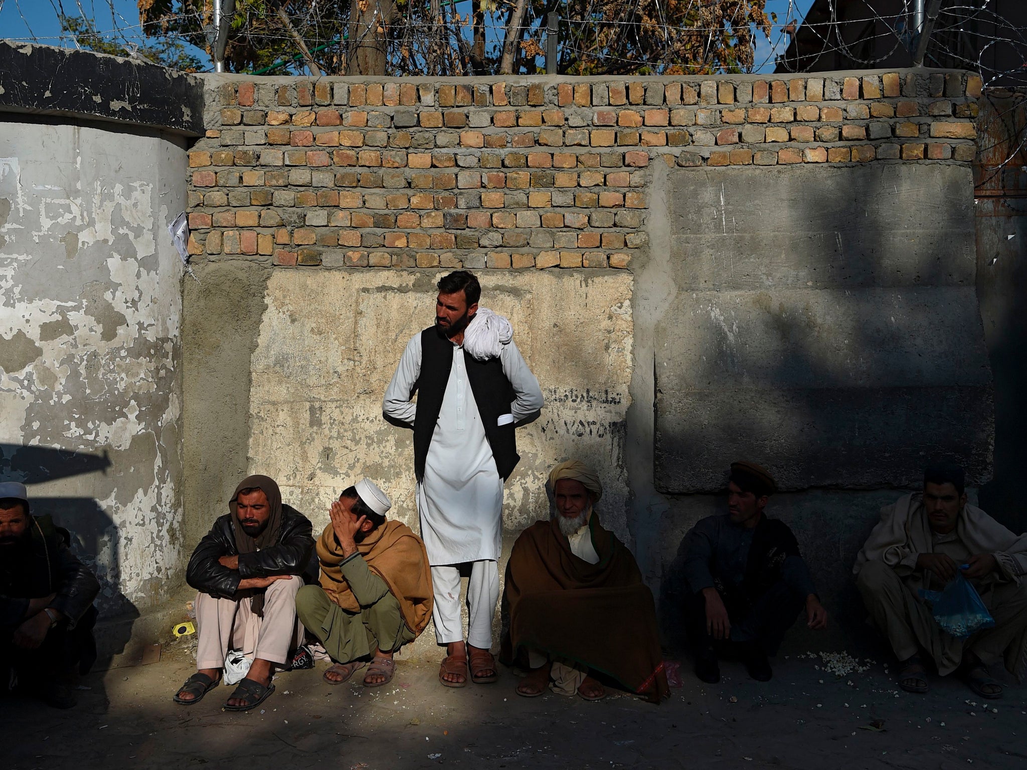 Afghans waiting for their visas outside Pakistan’s embassy, in Kabul on 4 November, 2019