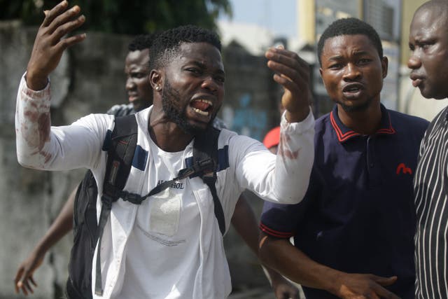 Alister, a protester who says his brother Emeka died from a stray bullet from the army, reacts while speaking to Associated Press near Lekki toll gate in Lagos