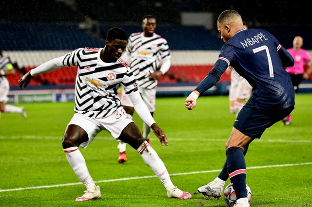 Axel Tuanzebe challenges PSG’s Kylian Mbappe