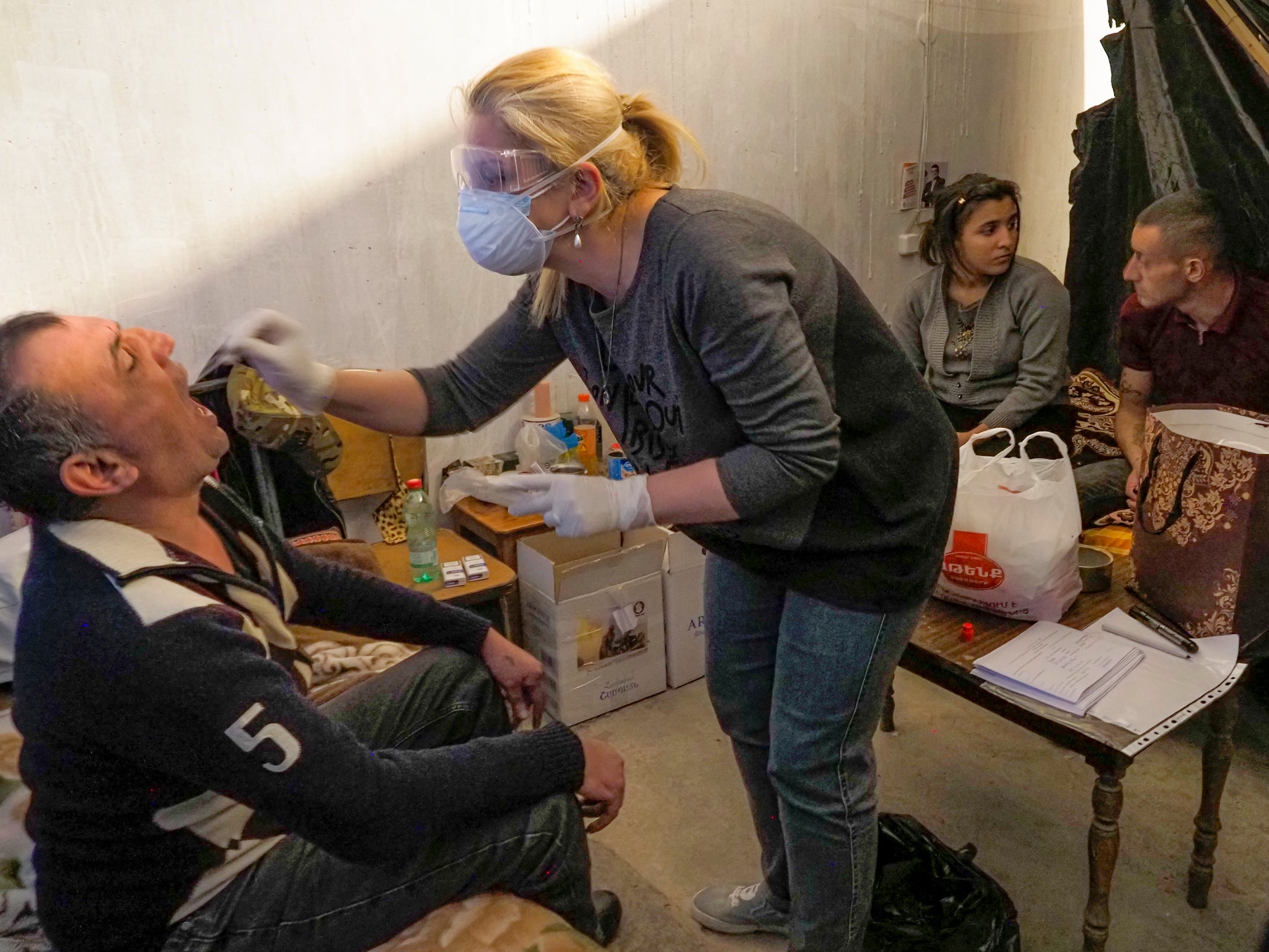 A medical worker collects sample for COVID-19 inside a bomb shelter in Stepanakert, the separatist region of Nagorno-Karabakh on 20 October, 2020