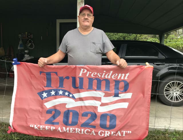 Larry Crews built his own pro-Trump sign - but wears a mask when he leaves home