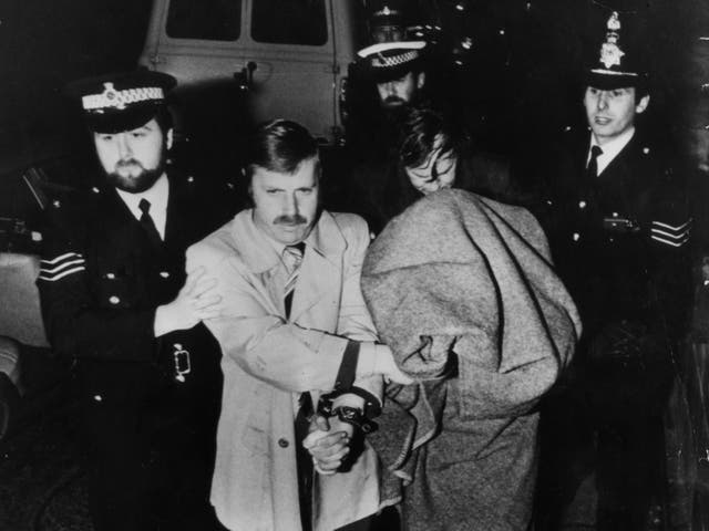 Peter Sutcliffe, aka The Yorkshire Ripper, is brought into Dewsbury Court under a blanket