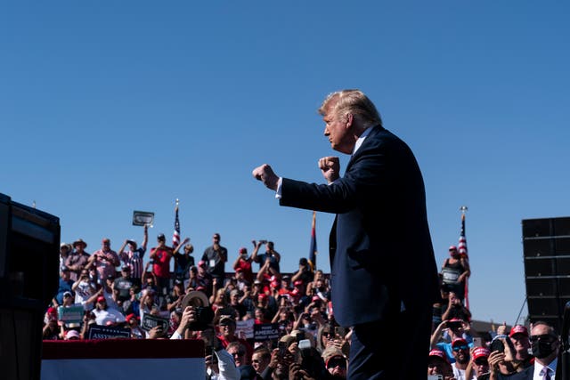 <p>File. In this 19 October 2020 photo, Donald Trump dances to the iconic 70’s disco band Village People’s “YMCA” after speaking at a campaign rally at Prescott Regional Airport, in Prescott, Arizona </p>