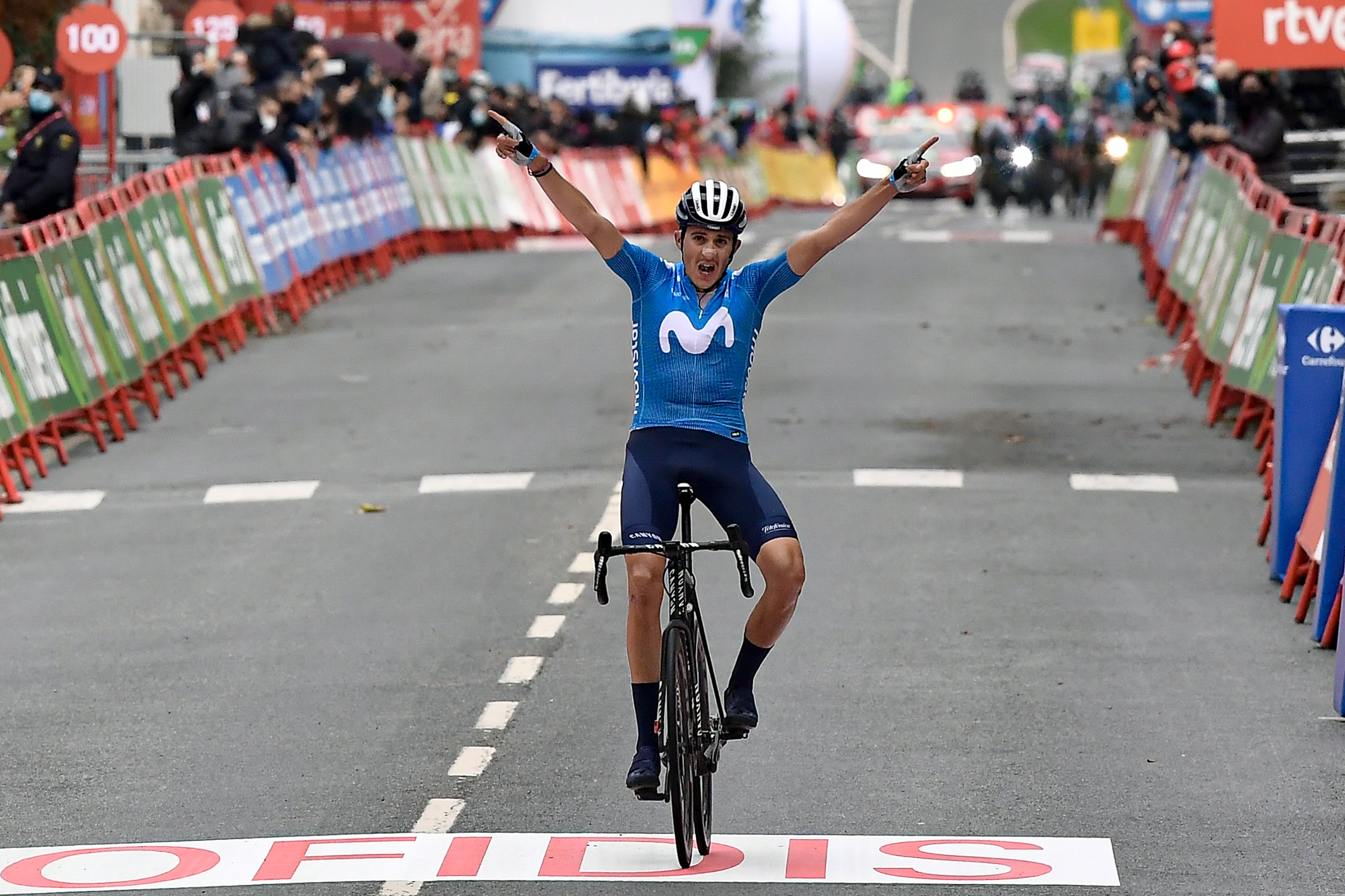 Marc Soler celebrates as he crosses the finish line