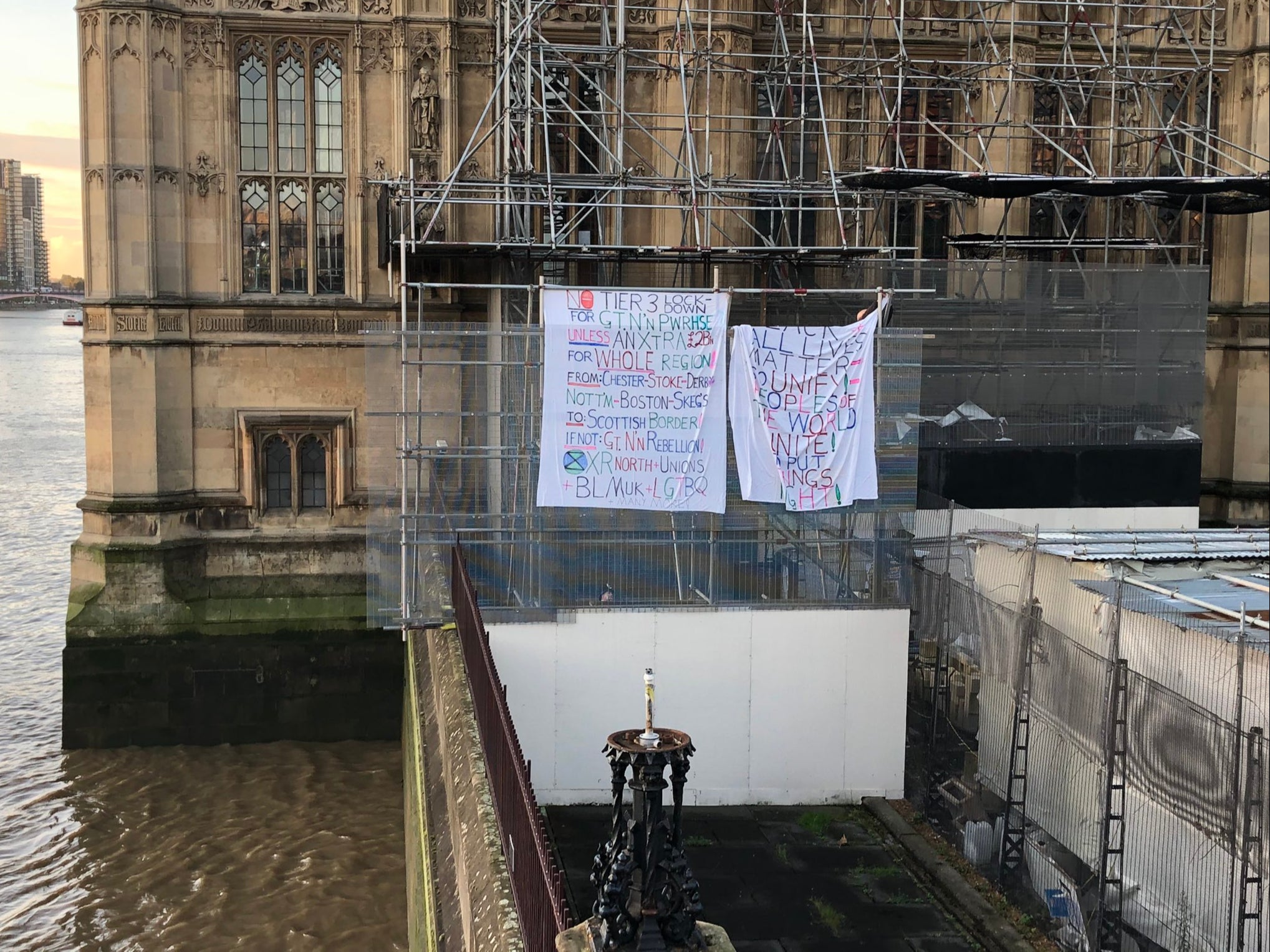 Banners displayed by activist on Big Ben’s scaffolding, photographed by a passerby
