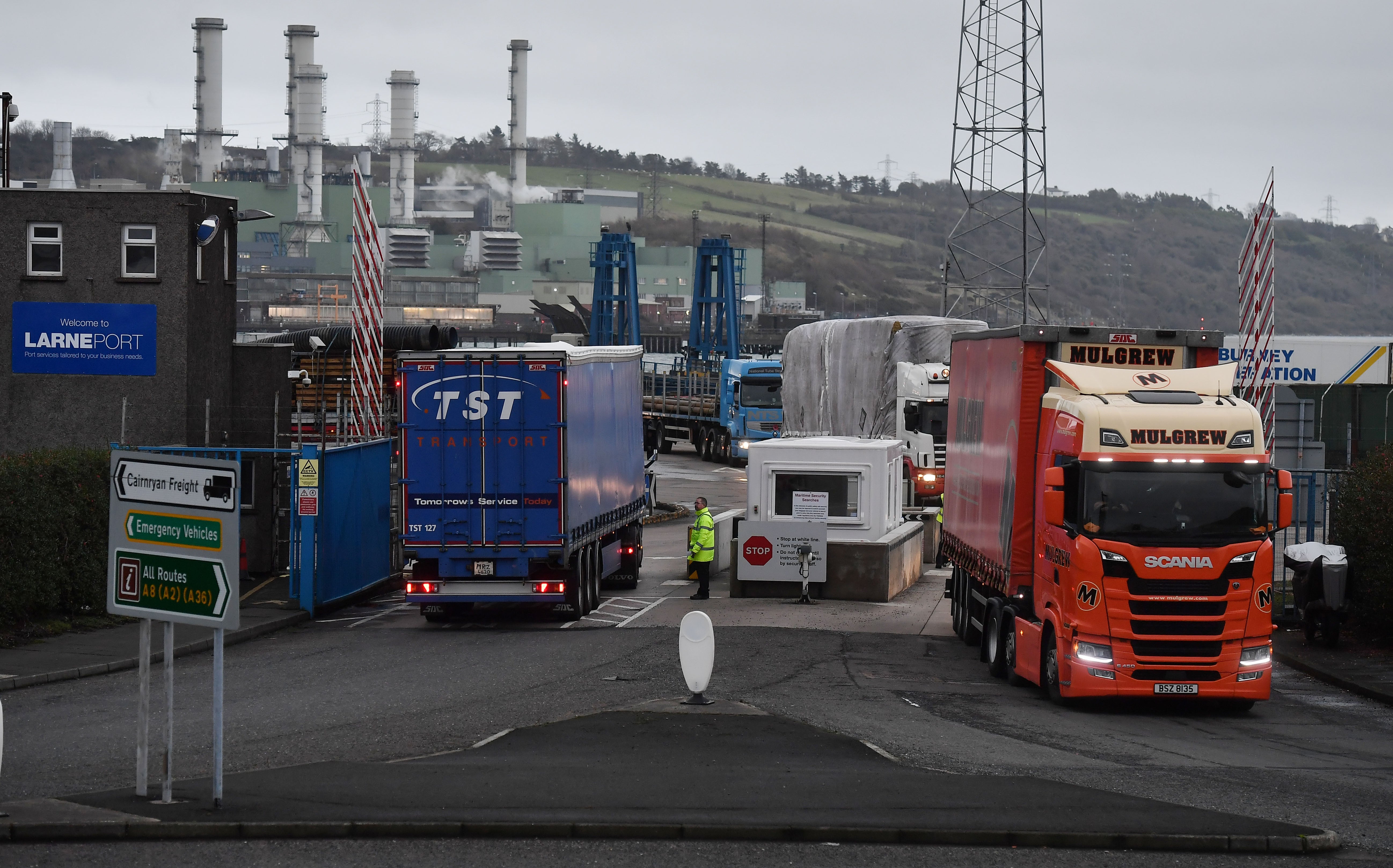 LARNE, NORTHERN IRELAND Port officers inspect vehicles at a checkpoint in Larne
