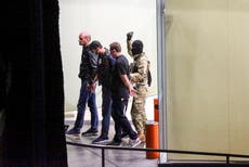 Bank robber who held 40 people hostage flees with $500,000