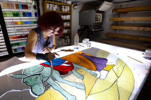 Maya Husseini works on a piece for a cathedral under construction in Jordan, in her basement workshop on the outskirts of Beirut, on 18 September 2020