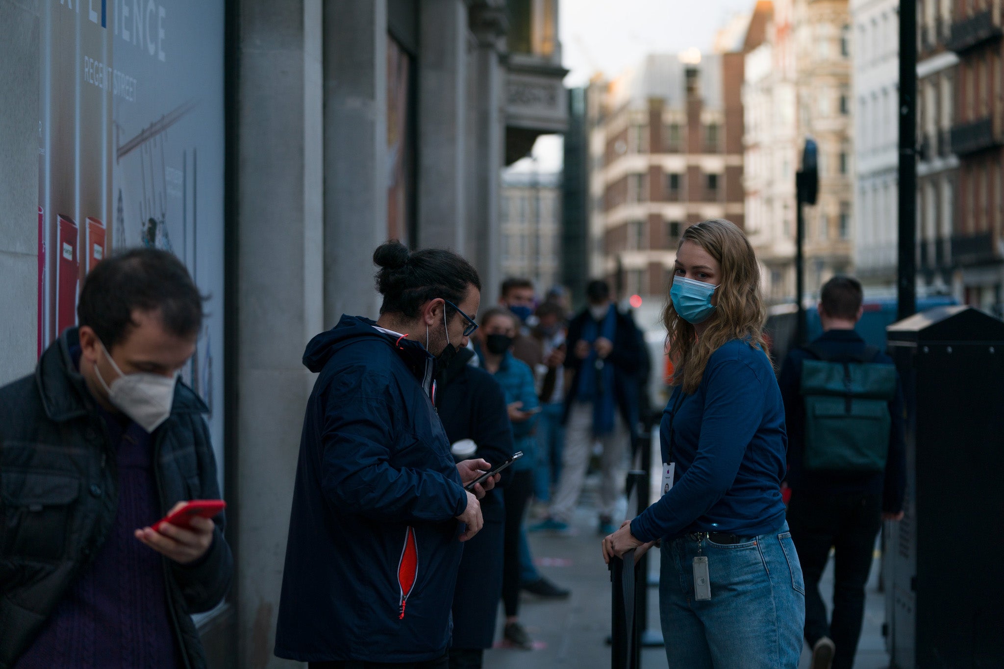 Customers socially distance as they queue for the new iPhone 12 and iPhone 12 Pro on launch day on October 23 in London